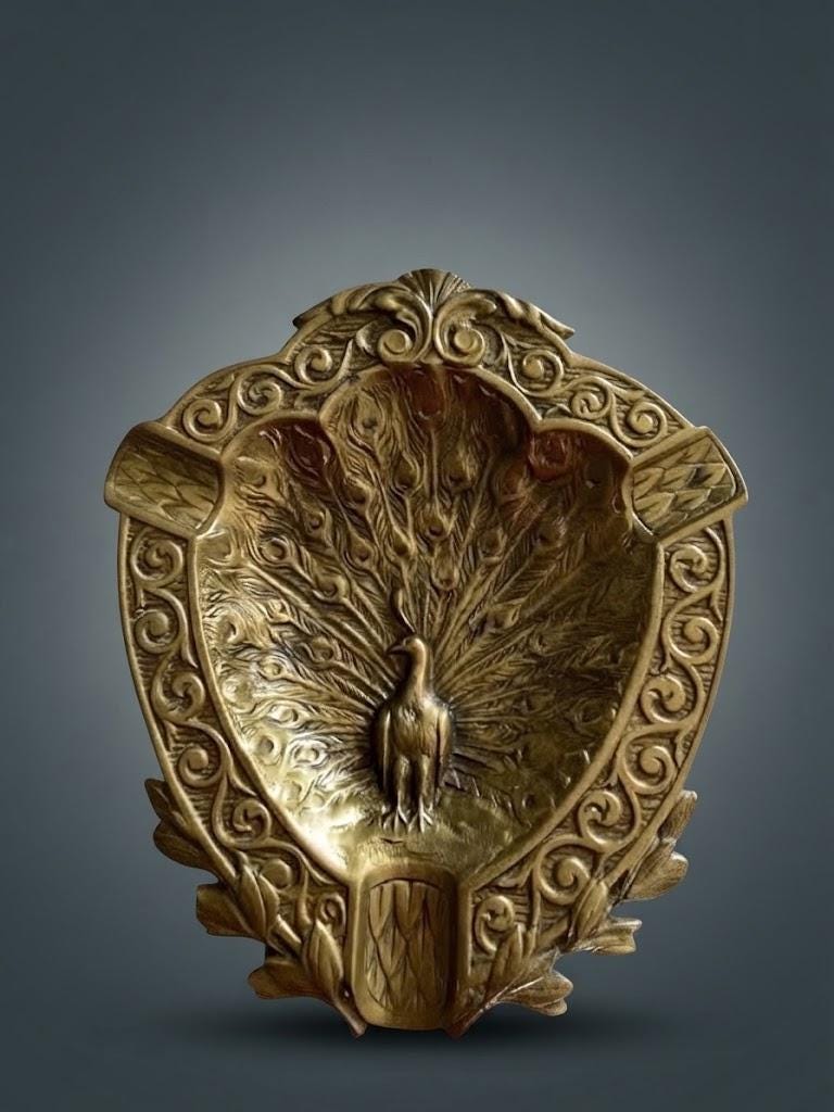 Brass-Tone Peacock Trinket Dish and Ashtray, Shield-Shaped with Scroll Border and Relief Tail Feathers, Art Nouveau Style