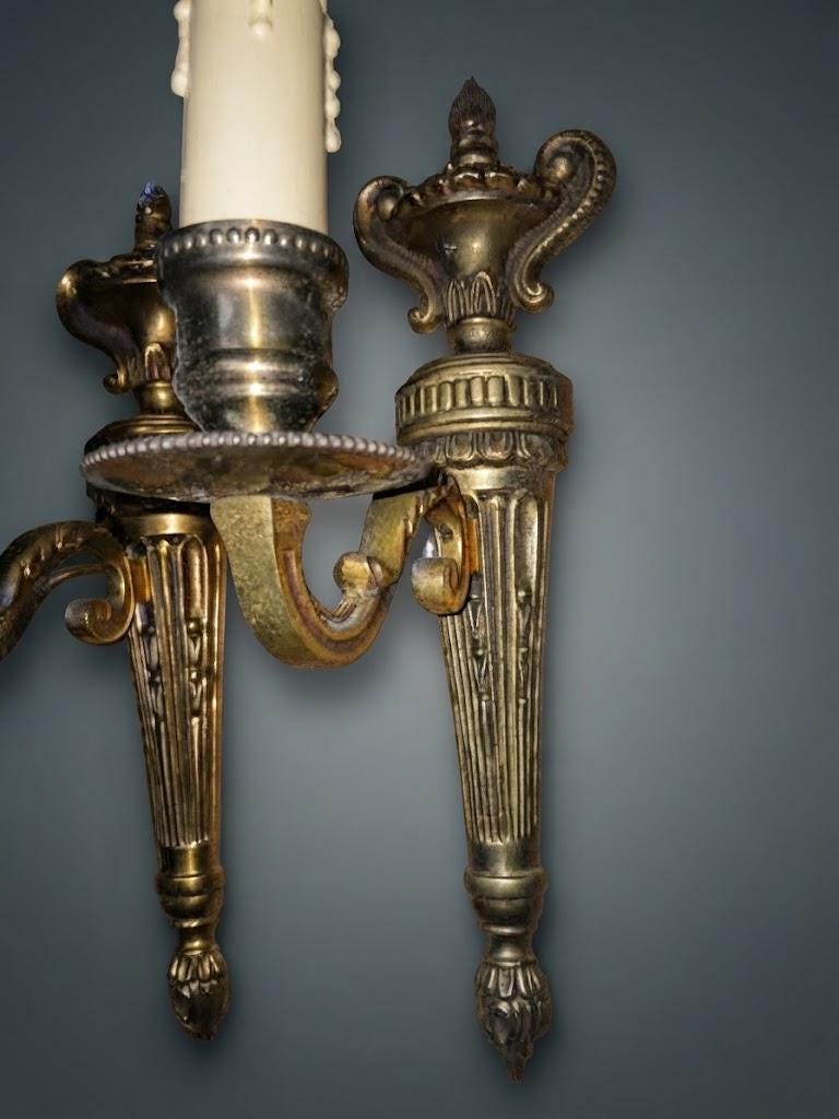 Pair of Louis XVI Style Single-Arm Wall Sconces, Gold-Tone Metal with Fluted Back Plates, Urn Tops and Beaded Drip Pans