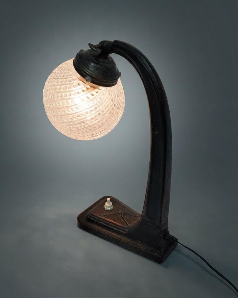 Vintage Art Deco Desk Lamp, Arched Patinated Metal Arm on Stepped Base with Clear Patterned Glass Globe