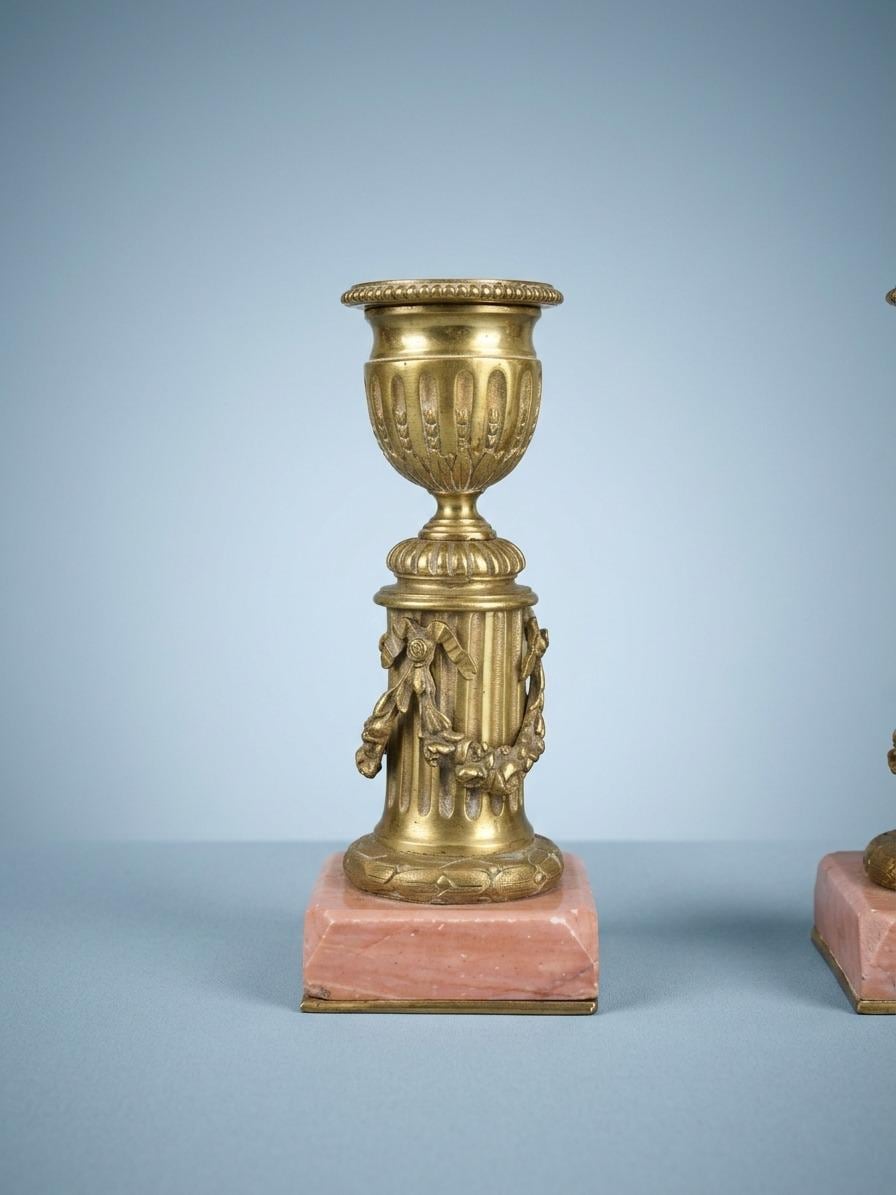 Antique Pair of Louis XVI Style Small Gilt Metal Candlesticks on Pink Veined Stone Plinths, Fluted Columns with Festoons