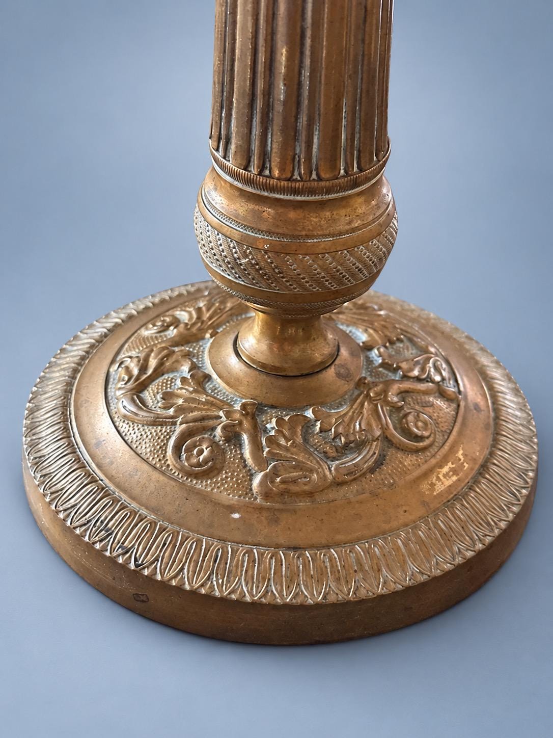 Vintage Pair of Empire Style Patinated Brass-Tone Candlesticks, Fluted Columns, Acanthus Collars and Foliate Bases