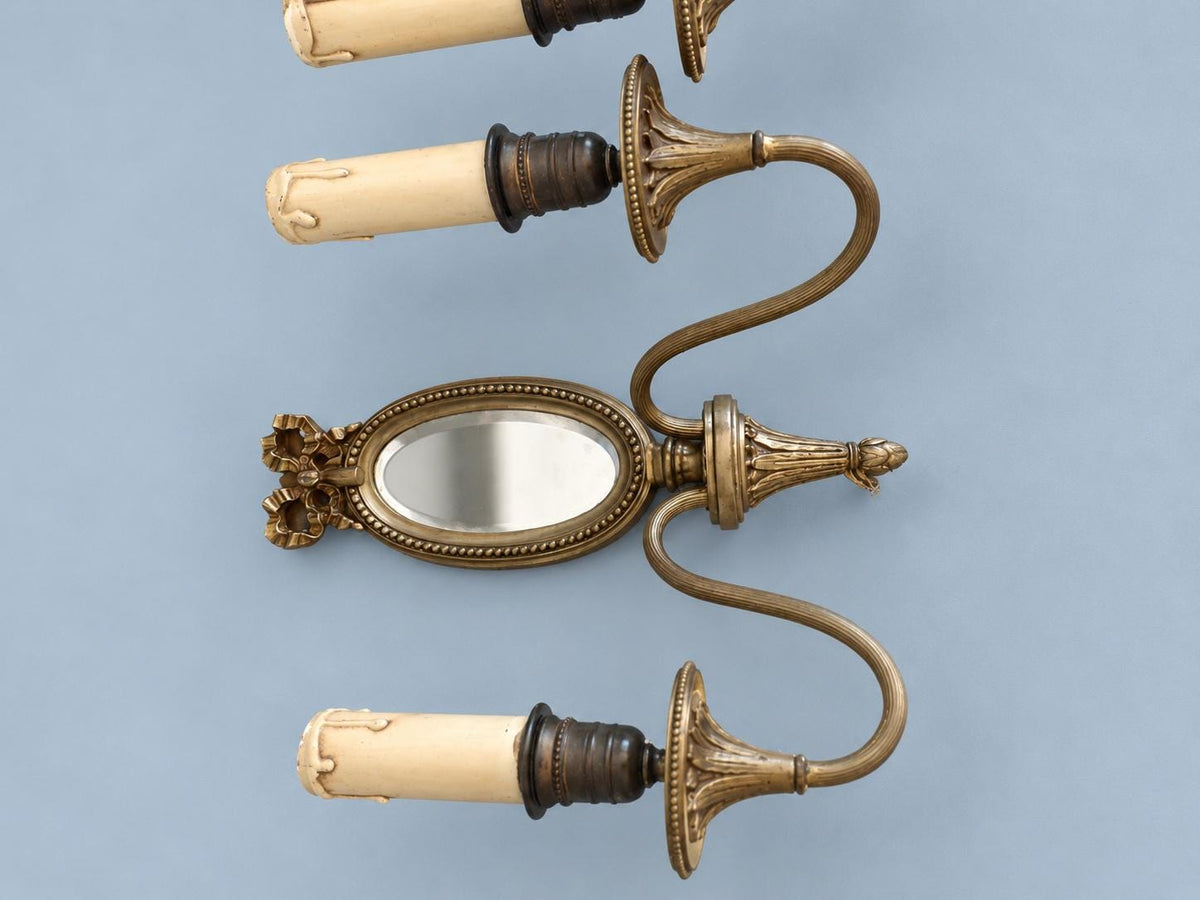 Vintage Pair of Louis XVI Style Two-Arm Wall Sconces with Oval Bevelled Mirrors and Ribbon Bows