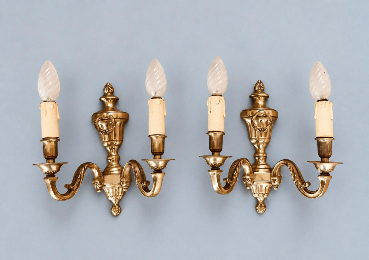 Vintage Pair of French Louis XVI Style Gilt Metal Two-Arm Wall Sconces with Urn and Laurel Wreath