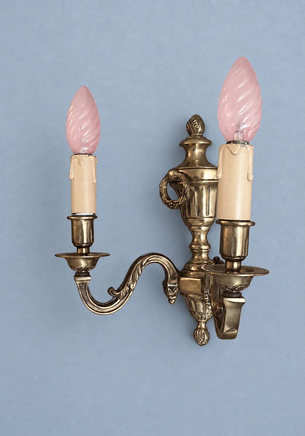 Vintage Pair of French Louis XVI Style Gilt Metal Two-Arm Wall Sconces with Urn and Laurel Wreath