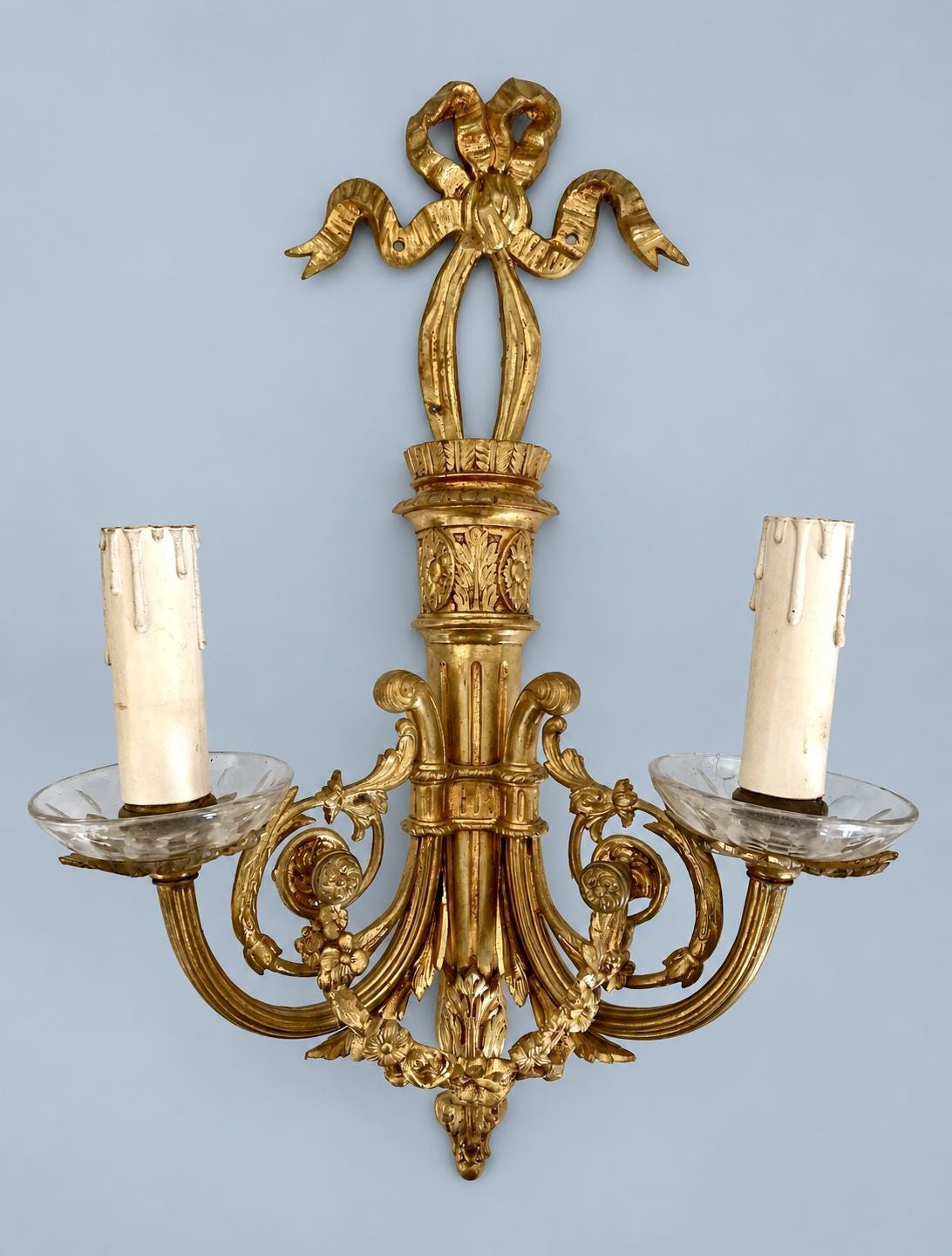Vintage Pair of Louis XVI Style Brass-Tone Two-Arm Wall Sconces with Ribbon Bow, Flower Garlands and Glass Drip Pans