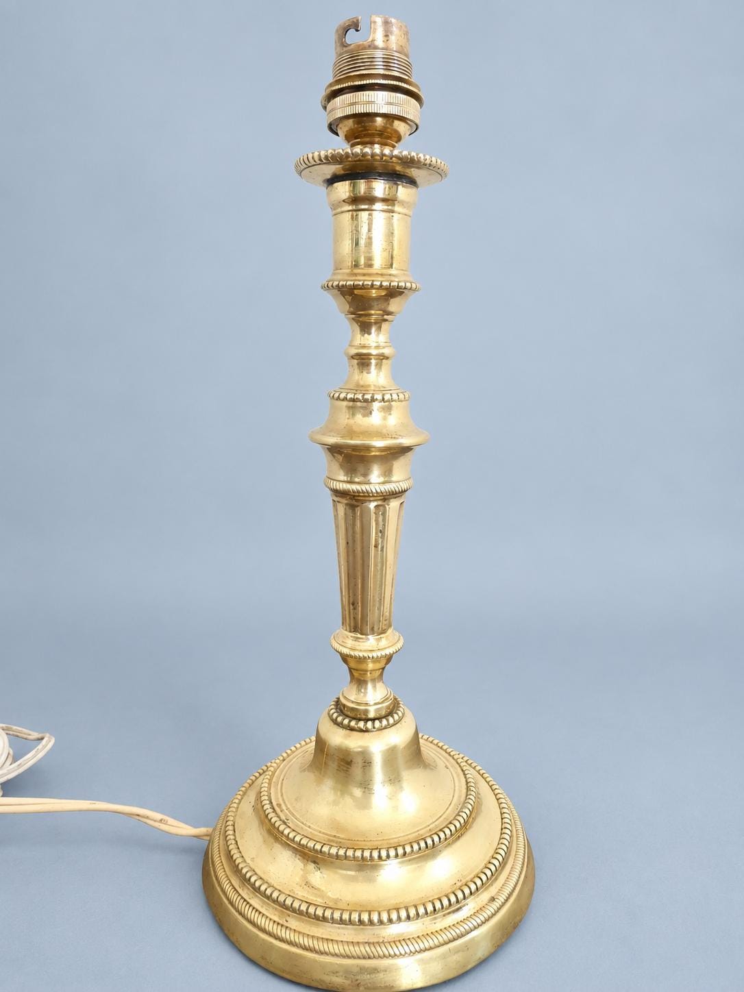 Antique Louis XVI Style Brass-Tone Candlestick Table Lamp with Beaded Friezes and Fluted Stem