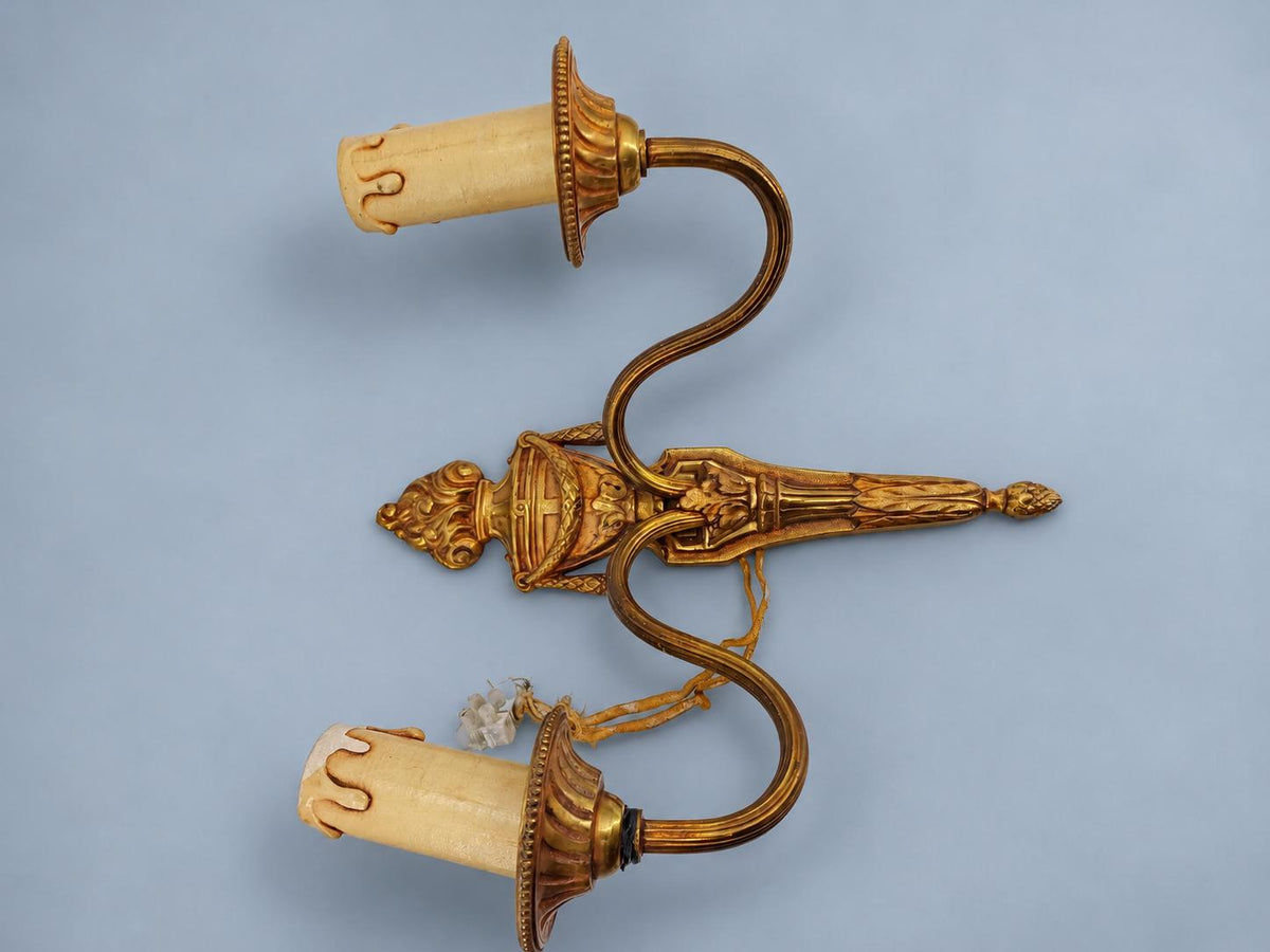Vintage Pair of Louis XVI Style Two-Arm Gilt Metal Wall Sconces with Flaming Urns and Tasselled Swags