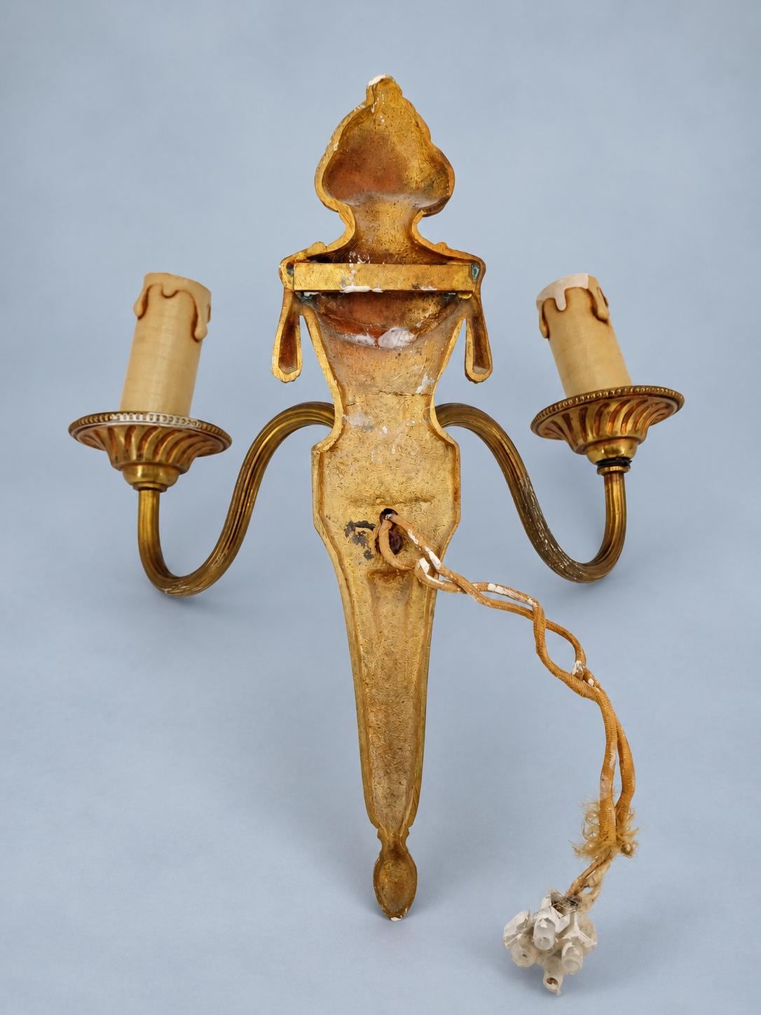 Vintage Pair of Louis XVI Style Two-Arm Gilt Metal Wall Sconces with Flaming Urns and Tasselled Swags