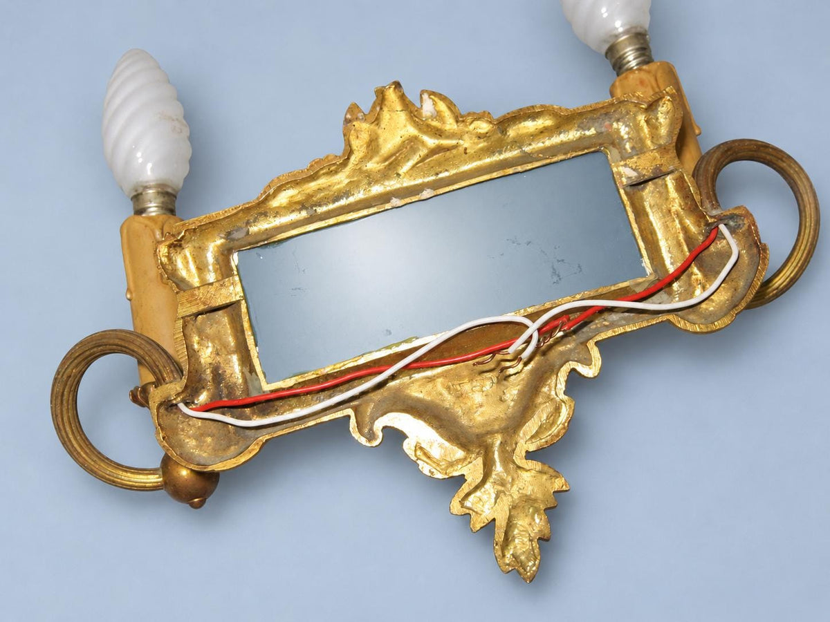 Vintage Pair of Louis XVI Style Two-Arm Gilt Metal Mirror Wall Sconces with Laurel Crests