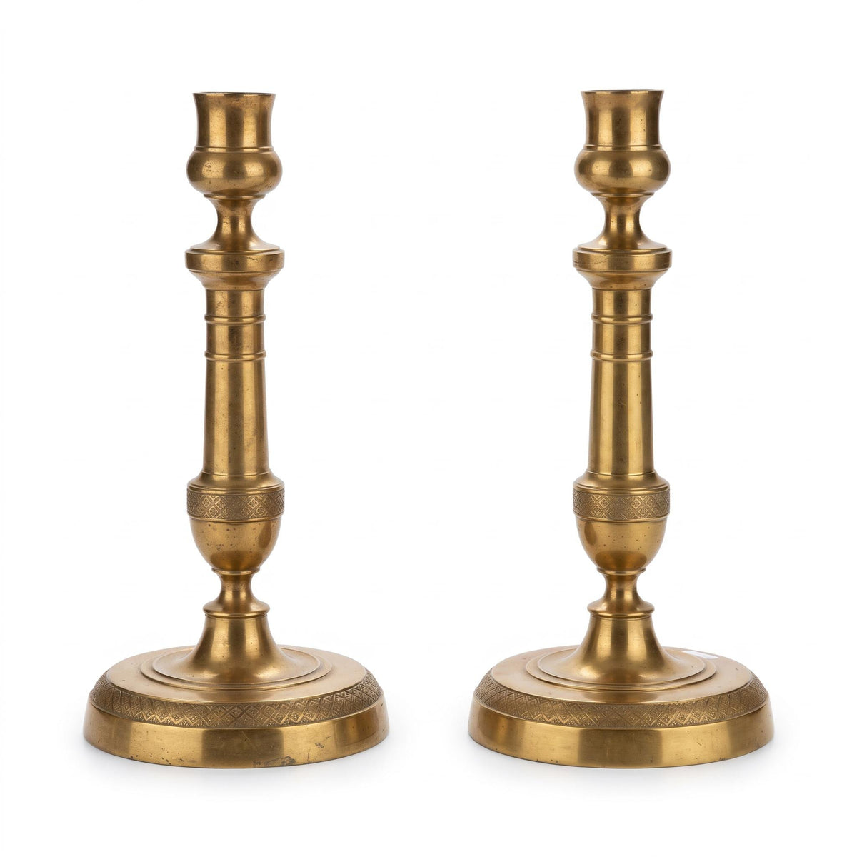 Antique Pair of Empire Style Brass-Tone Candlesticks with Ringed Shafts and Chased Diaper Bands, 19th Century