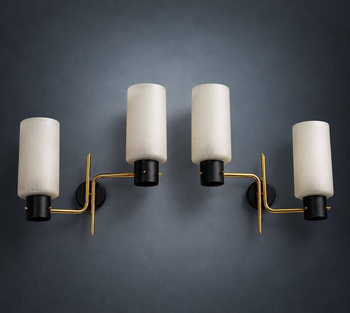 Pair of Mid-Century Double Wall Sconces, Ribbed Milk Glass Cylinders, Matte Black and Gold-Tone Metal Arms