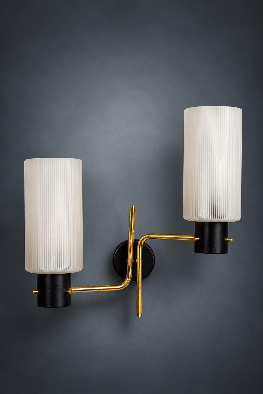 Pair of Mid-Century Double Wall Sconces, Ribbed Milk Glass Cylinders, Matte Black and Gold-Tone Metal Arms