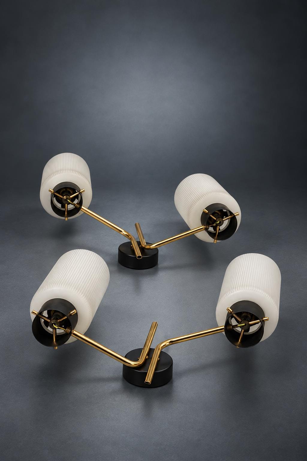 Pair of Mid-Century Double Wall Sconces, Ribbed Milk Glass Cylinders, Matte Black and Gold-Tone Metal Arms