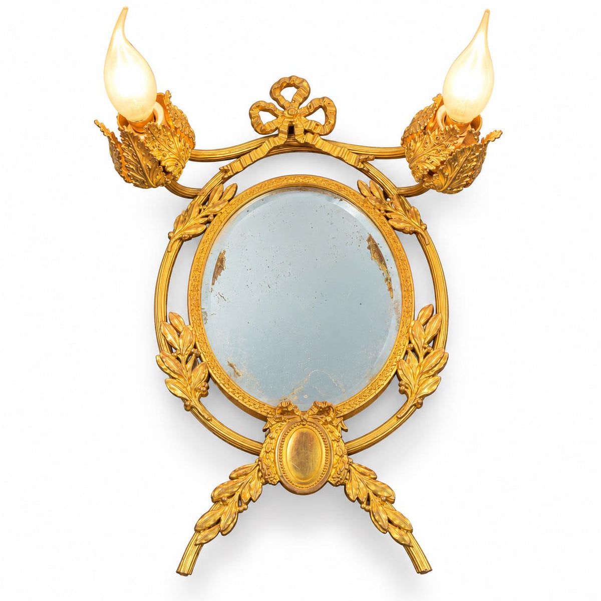 Louis XVI Style Mirrored Wall Sconce, Gilt Metal Girandole with Bevelled Oval Mirror, Ribbon Bow and Laurel, Two Lights