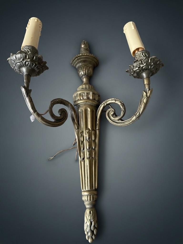 Set of Three Louis XVI Style Two-Arm Wall Sconces, Quiver Backplates with Ribbons, Leaf Cups and Pine Cone Drops