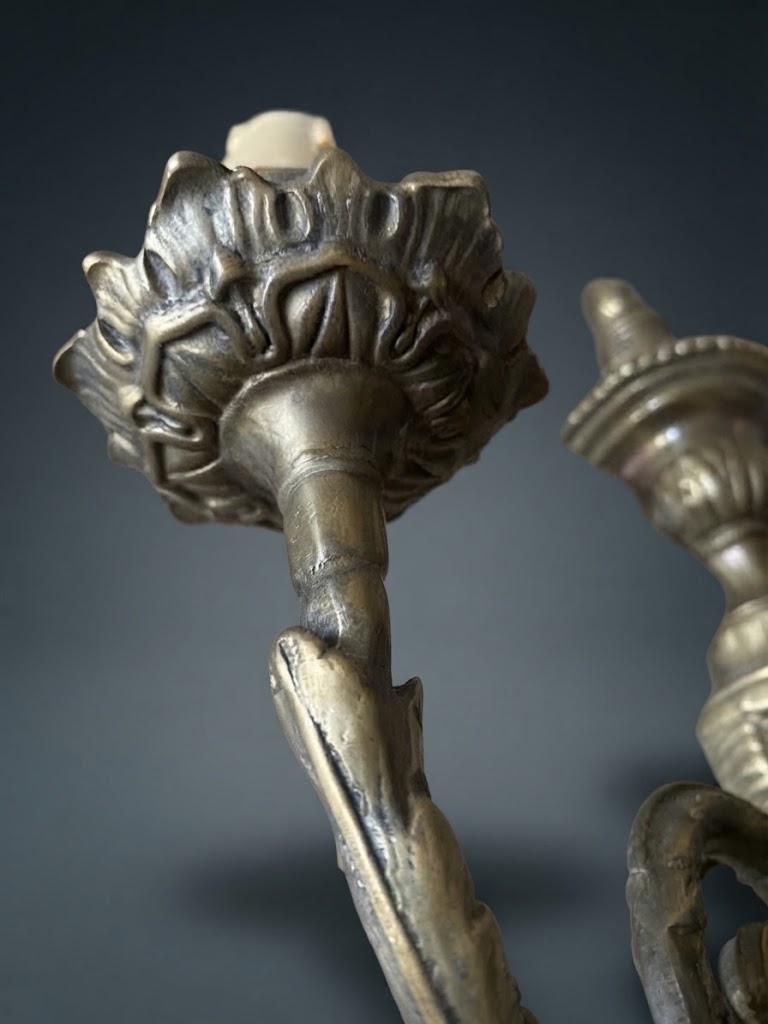 Set of Three Louis XVI Style Two-Arm Wall Sconces, Quiver Backplates with Ribbons, Leaf Cups and Pine Cone Drops