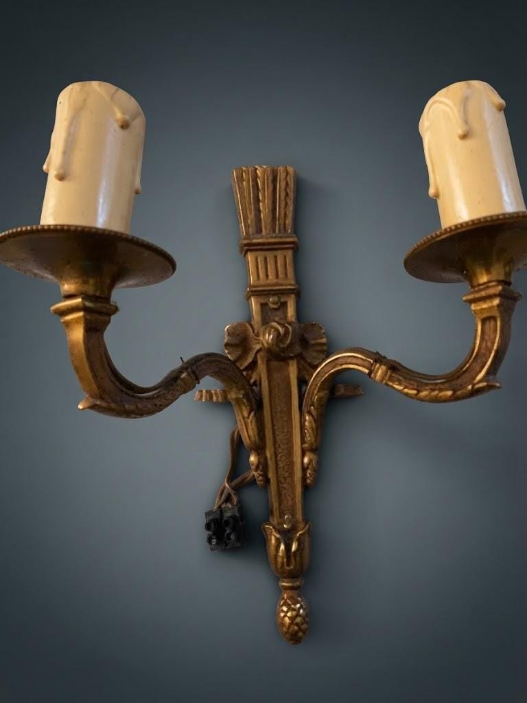 Pair of Small Louis XVI Style Two-Arm Wall Sconces, Bronze-Tone Quiver Backplates with Arrows, Ribbons and Pine Cone Drops