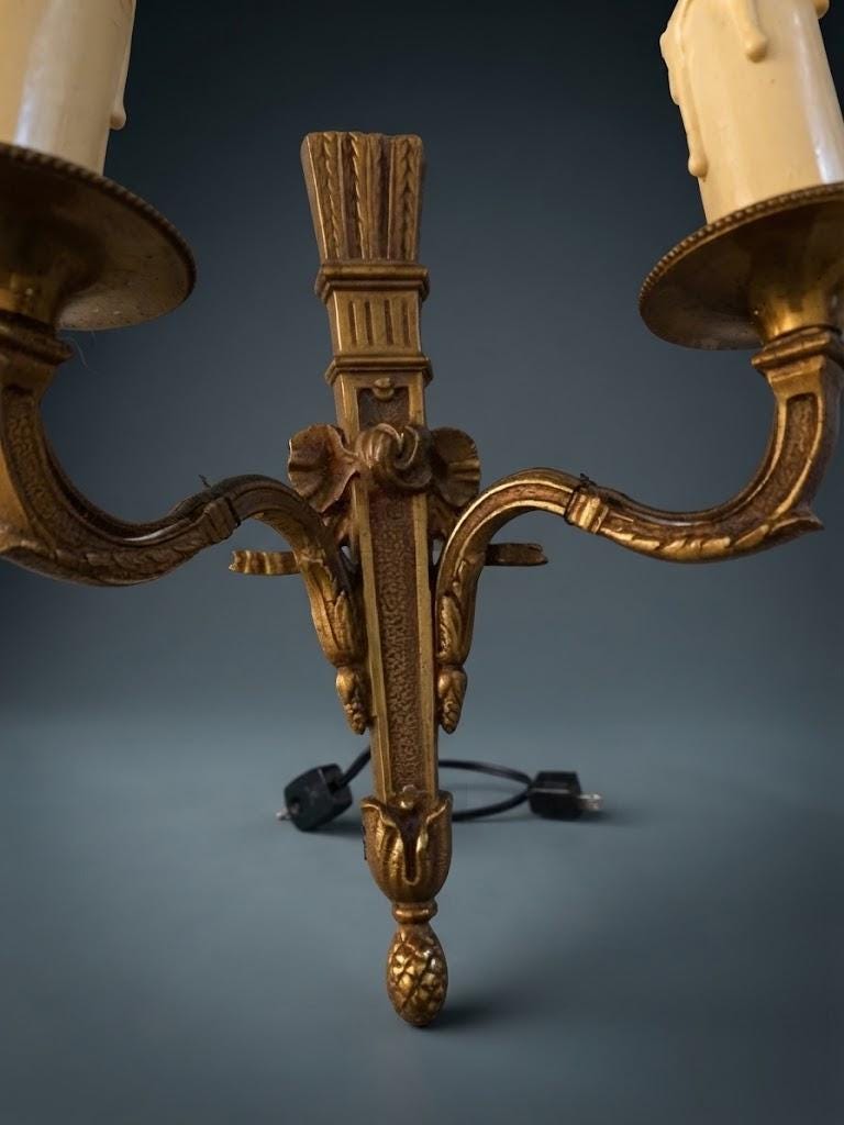 Pair of Small Louis XVI Style Two-Arm Wall Sconces, Bronze-Tone Quiver Backplates with Arrows, Ribbons and Pine Cone Drops