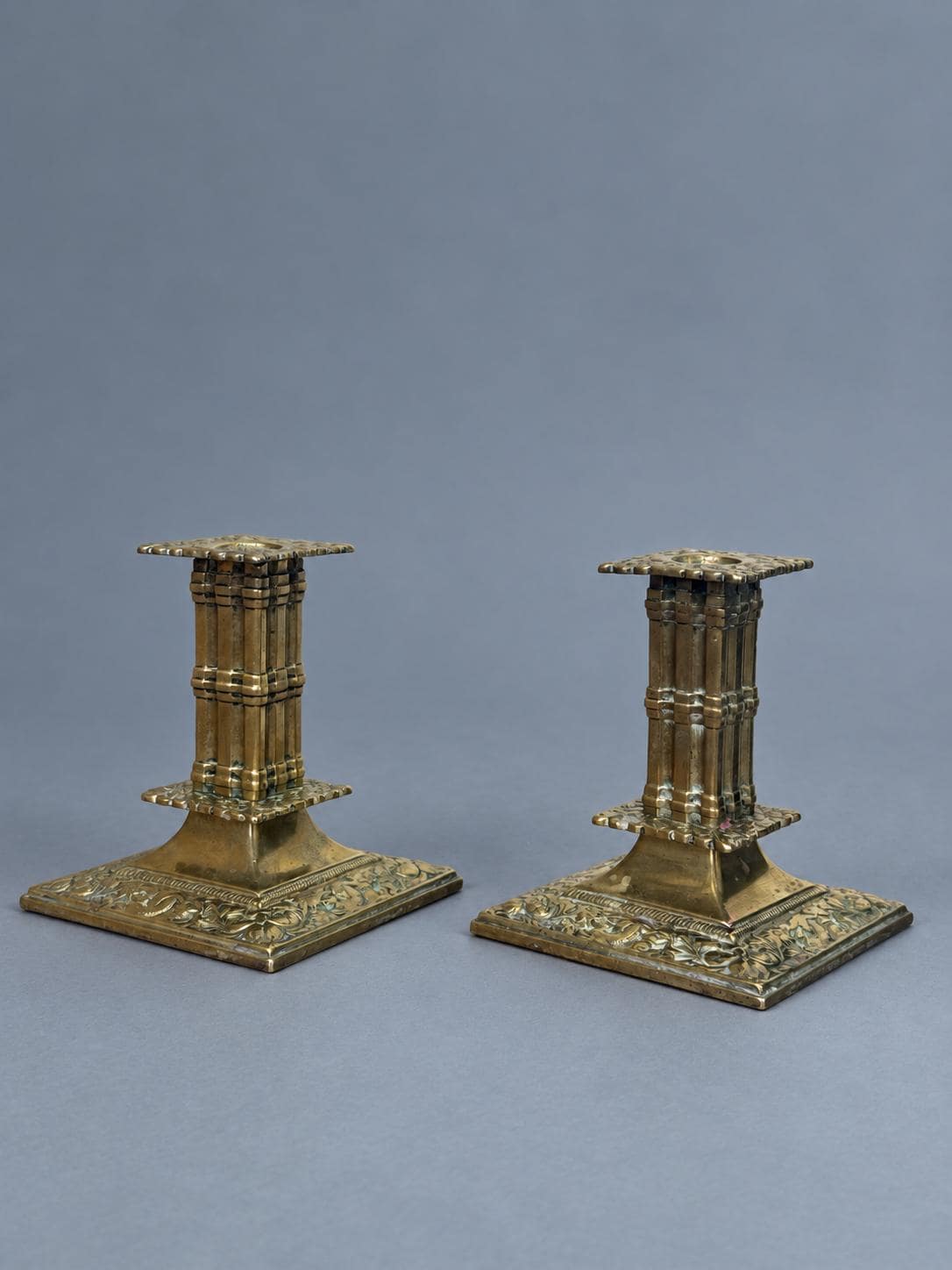Vintage Pair of Gothic Revival Brass Candlesticks, Clustered Columns on Square Leaf-Relief Bases, Troubadour Style, Attributed 19th Century