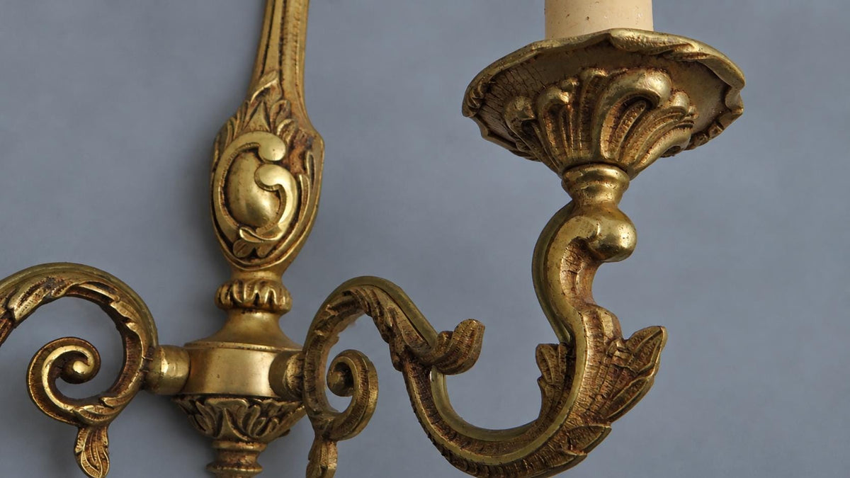 Vintage Pair of Louis XV Style Gilt Metal Wall Sconces, Flame Finials and C-Scroll Backplates, Leafy Scrolled Arms, Two Lights Each