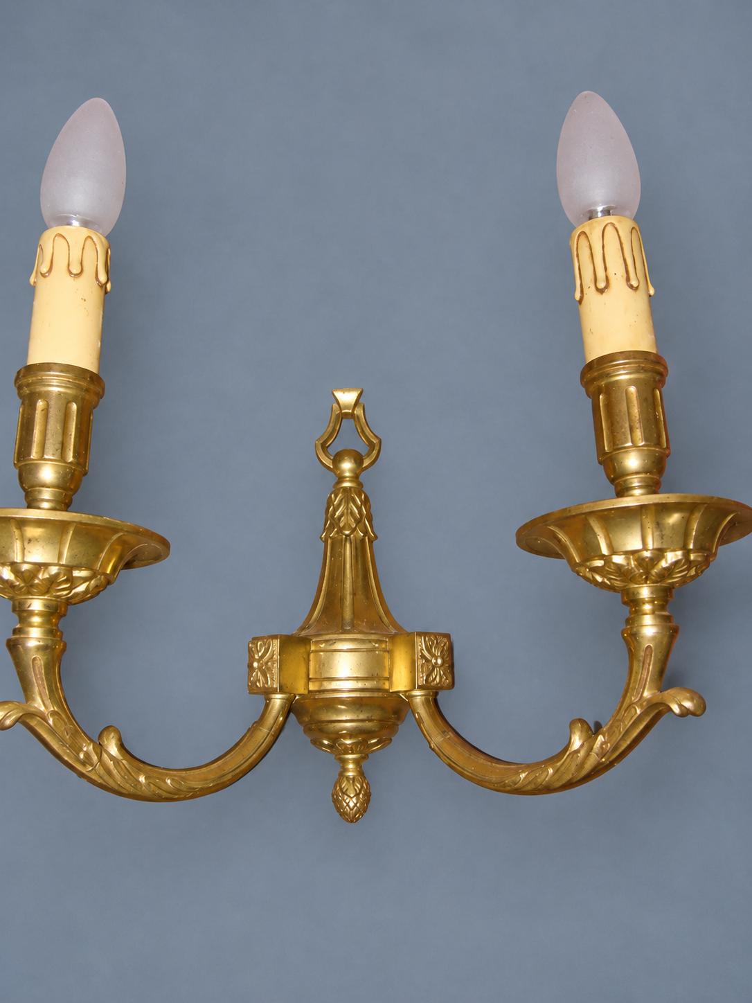 Vintage Pair of Louis XVI Style Gilt Metal Wall Sconces, Ring-Topped Baluster Backplates with Rosettes, Attributed Early 20th Century
