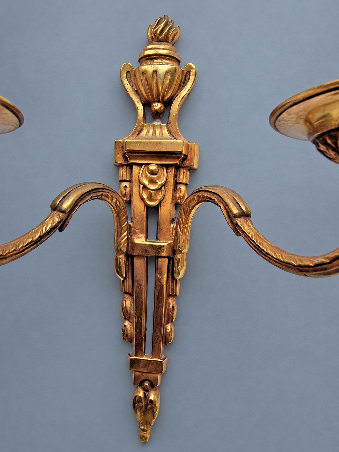 Vintage Pair of Louis XVI Style Two-Arm Candle Sconces, Gilt Metal with Flaming Urn Finials and Pierced Backplates, Late 19th Century, 26 cm