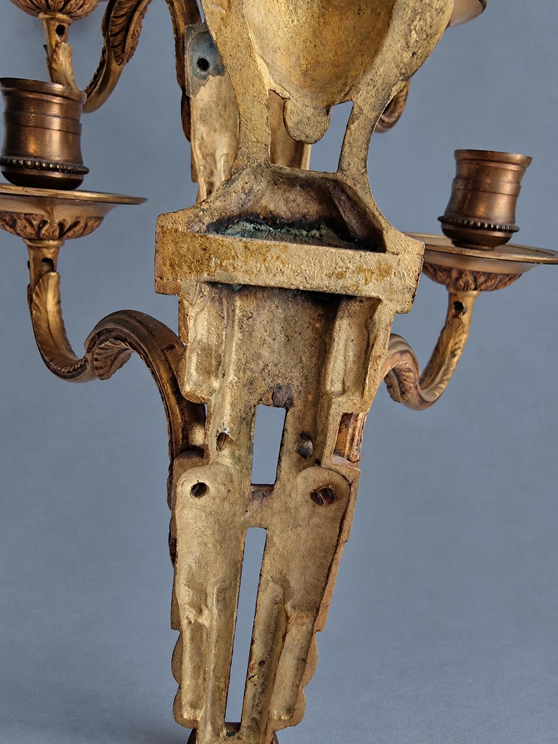 Vintage Pair of Louis XVI Style Two-Arm Candle Sconces, Gilt Metal with Flaming Urn Finials and Pierced Backplates, Late 19th Century, 26 cm