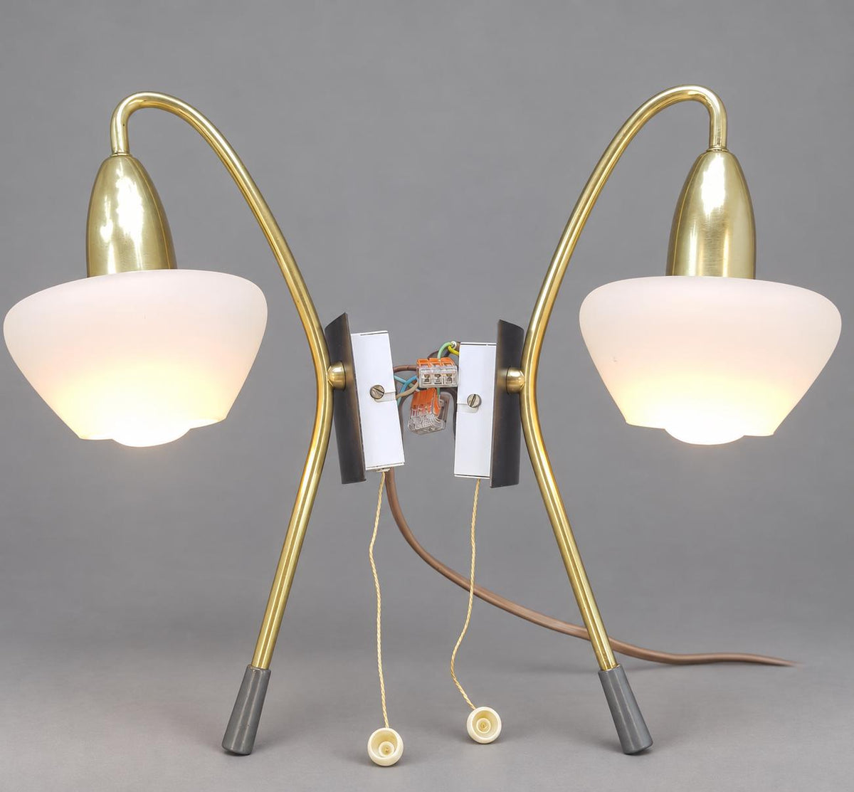 Vintage Pair of Mid-Century Modernist Wall Sconces, Attributed 1950s–60s, Brass Crook Arms with White Satin Glass Shades, Pull-Cord Switches