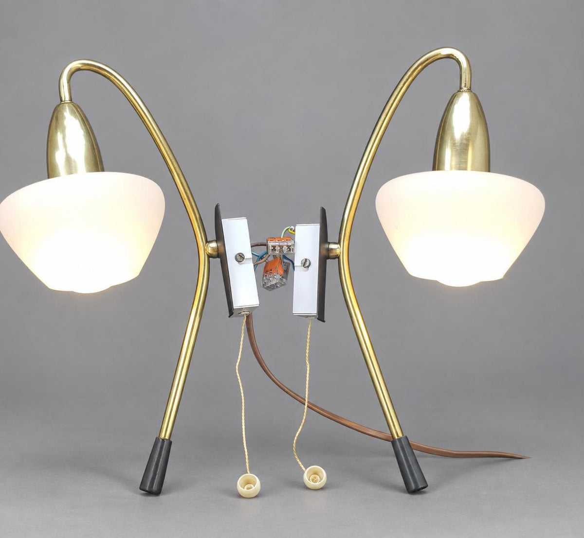 Vintage Pair of Mid-Century Modernist Wall Sconces, Attributed 1950s–60s, Brass Crook Arms with White Satin Glass Shades, Pull-Cord Switches