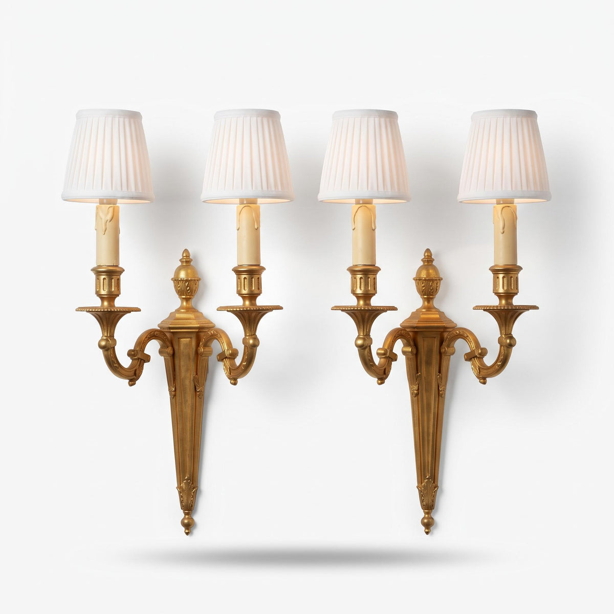 Pair of Louis XVI Style Two-Arm Wall Sconces, Gilt Metal with Scrolled Arms, Beaded Drip Pans and Urn Finials