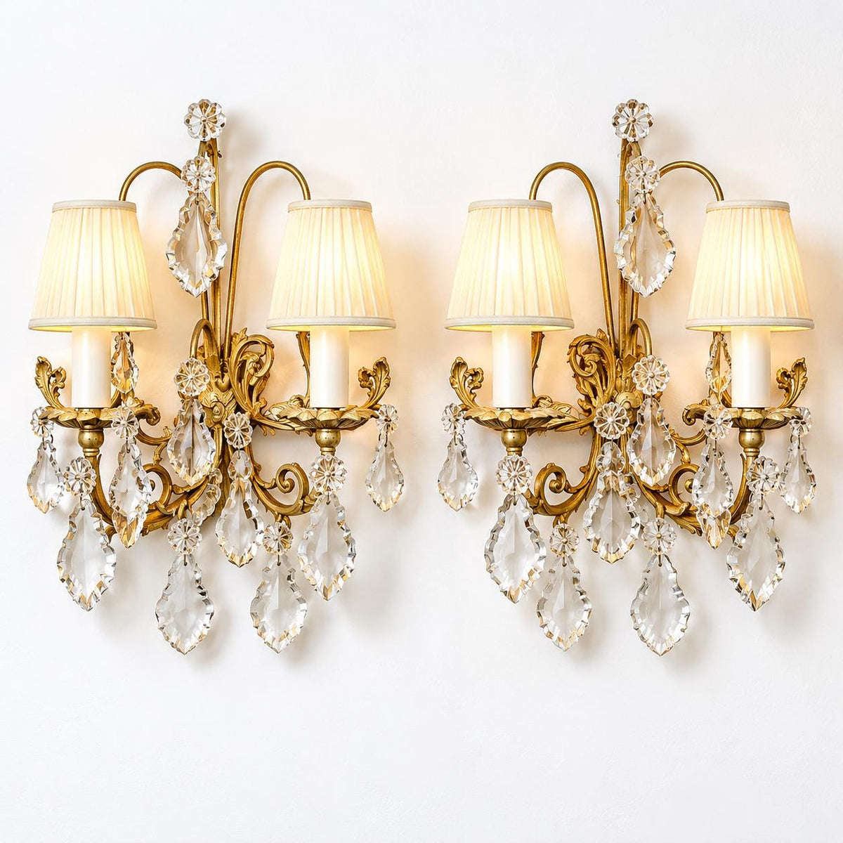 Vintage Pair of Gilt Metal Wall Sconces with Faceted Glass Drops, Two Lights Each, Scrolled Arms and Arched Hoops, Early 20th Century, 33 cm
