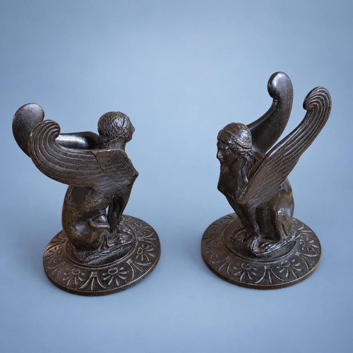 Vintage Pair of Neoclassical Style Winged Sphinx Figures, Patinated Metal on Palmette Bases, Sold as Bookends