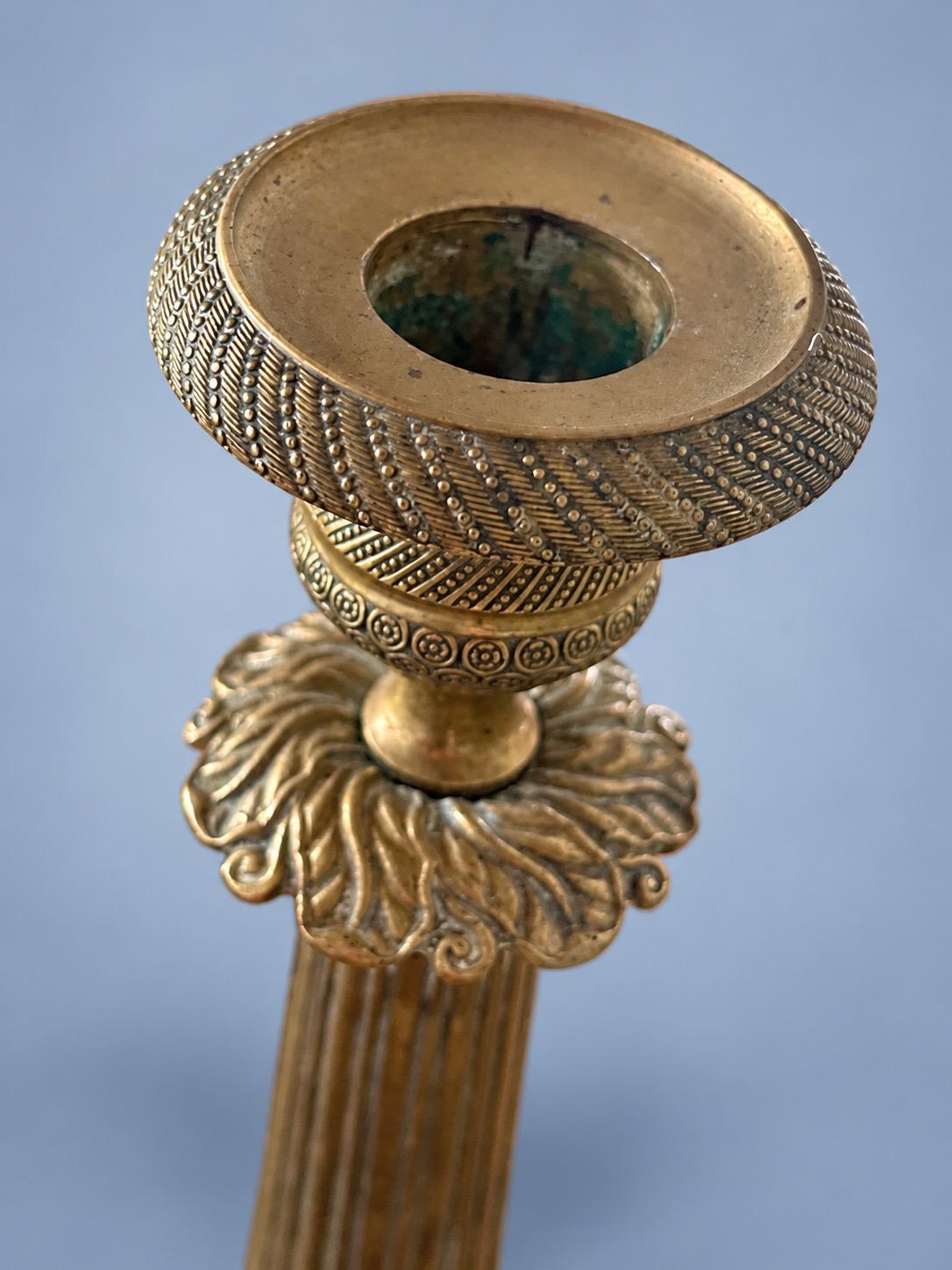 Vintage Pair of Empire Style Patinated Brass-Tone Candlesticks, Fluted Columns, Acanthus Collars and Foliate Bases