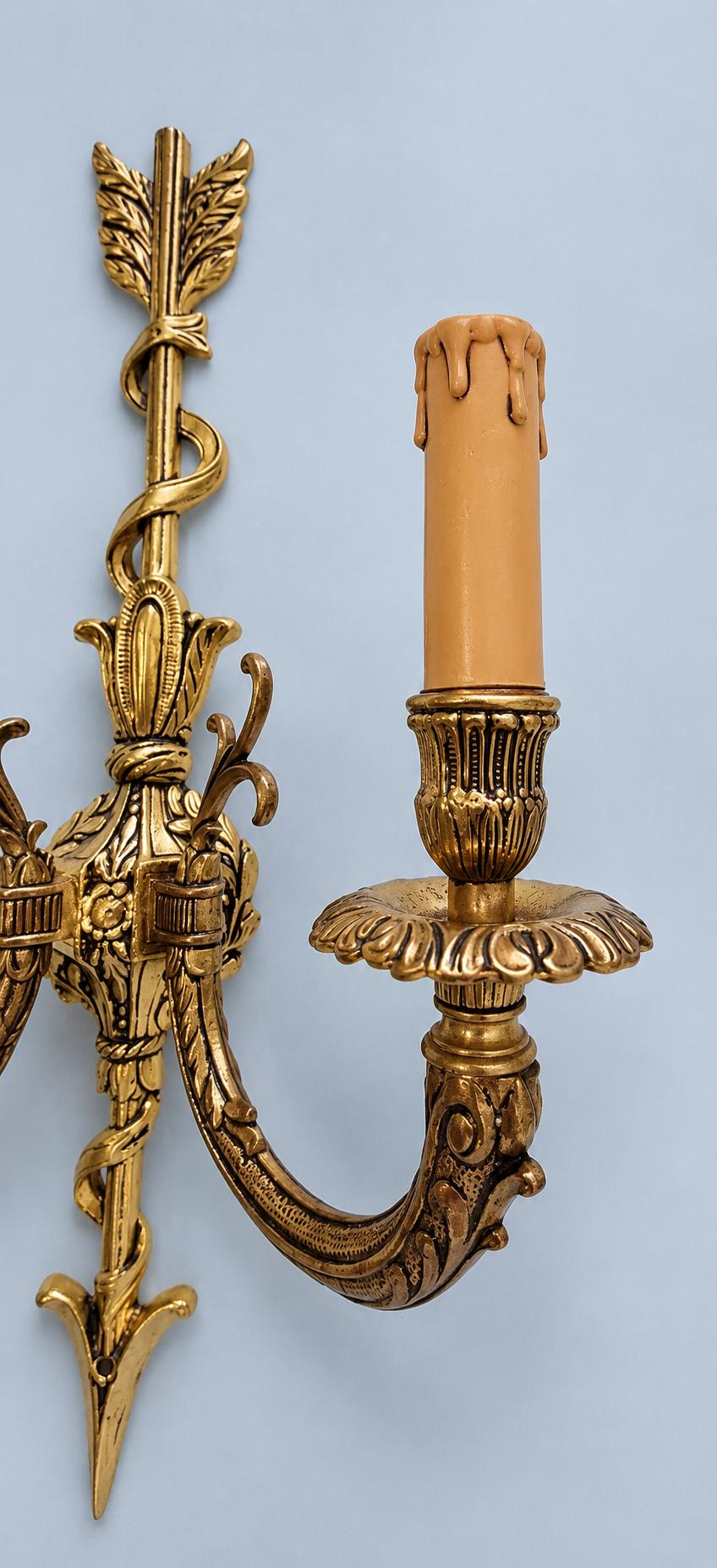 Vintage Pair of Louis XVI Style Gilt Metal Arrow and Ribbon Two-Arm Wall Sconces