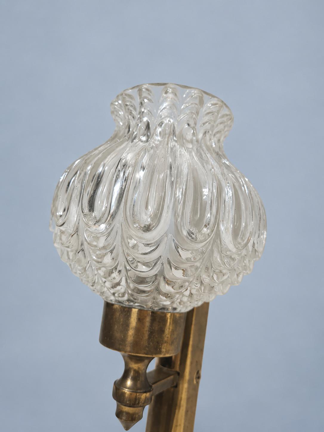 Vintage Pair of 1950s Brass-Tone Wall Sconces with Clear Teardrop-Pattern Glass Shades and Pull Cords