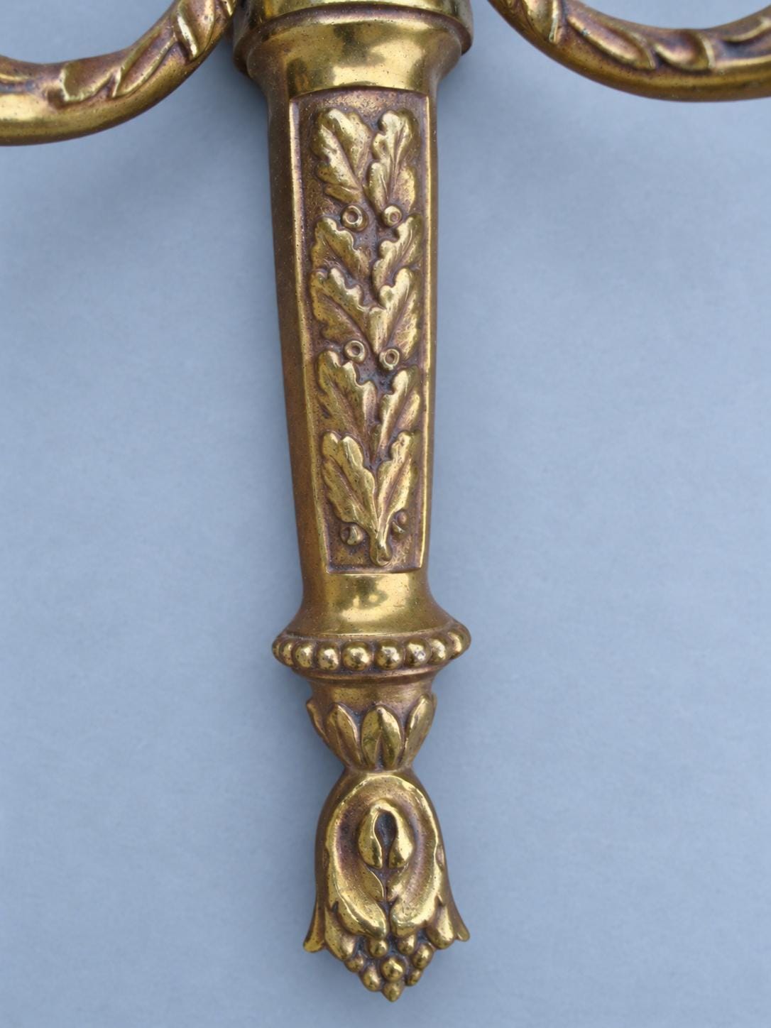 Vintage Pair of Louis XVI Style Brass-Tone Two-Arm Wall Sconces with Urn and Oak-Leaf Shaft