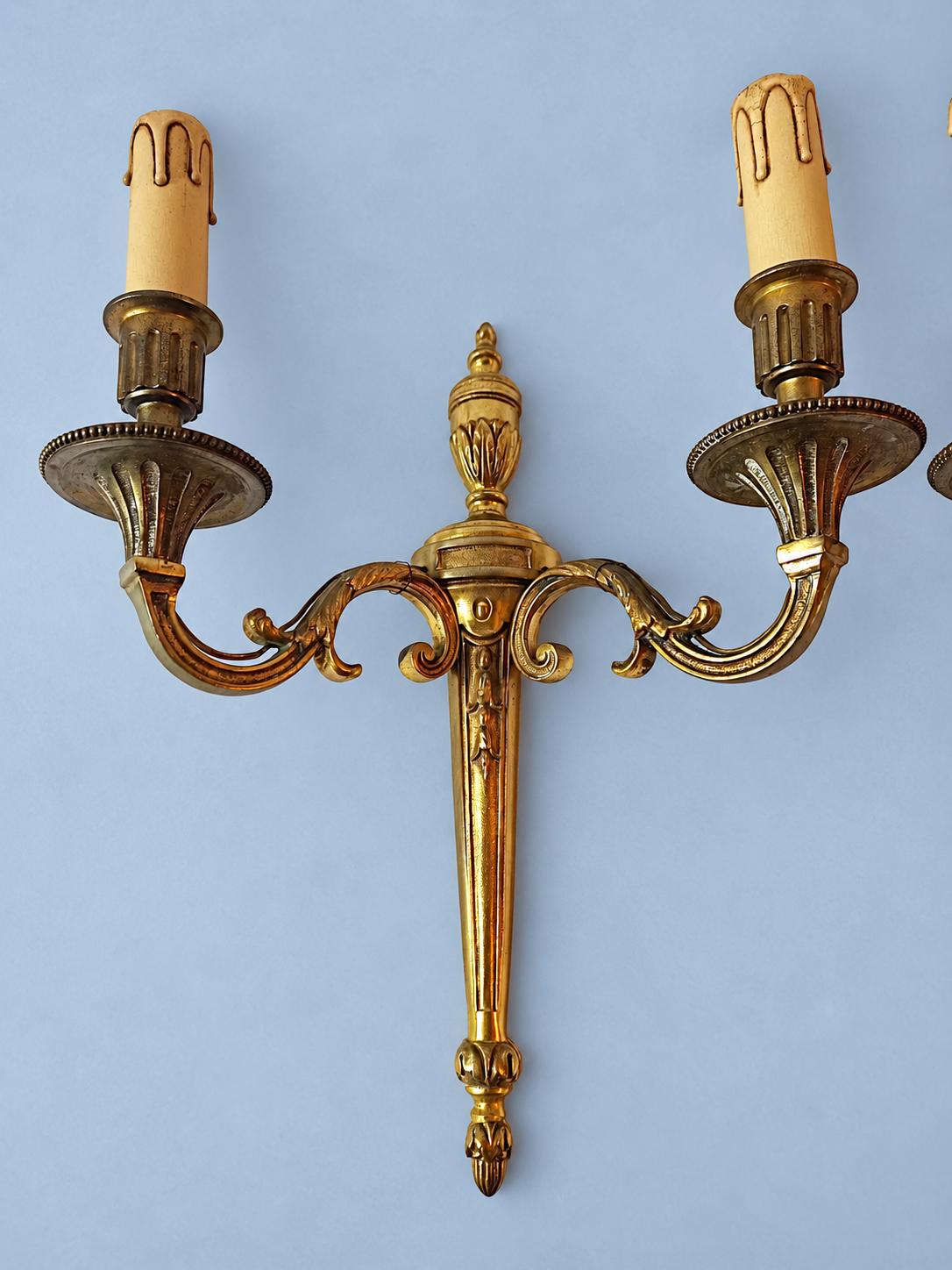 Antique Pair of Louis XVI Style Two-Arm Gilt Metal Torch Wall Sconces with Urn Finials and Beaded Drip Pans