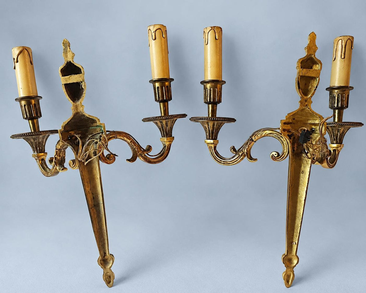 Antique Pair of Louis XVI Style Two-Arm Gilt Metal Torch Wall Sconces with Urn Finials and Beaded Drip Pans
