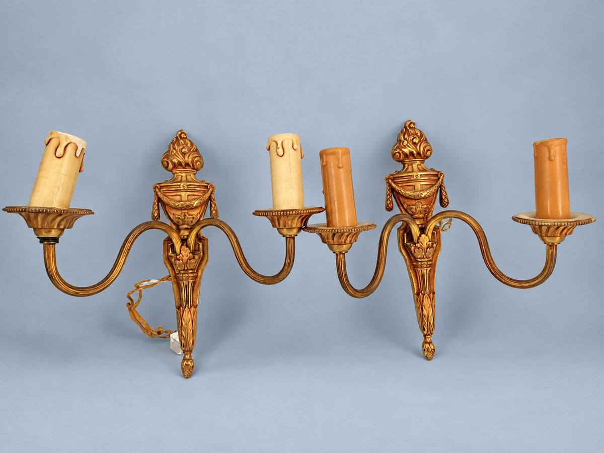 Vintage Pair of Louis XVI Style Two-Arm Gilt Metal Wall Sconces with Flaming Urns and Tasselled Swags