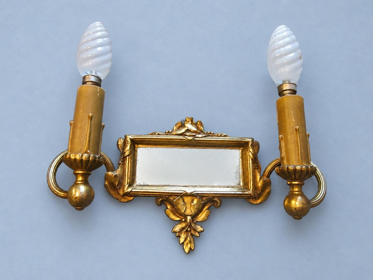 Vintage Pair of Louis XVI Style Two-Arm Gilt Metal Mirror Wall Sconces with Laurel Crests