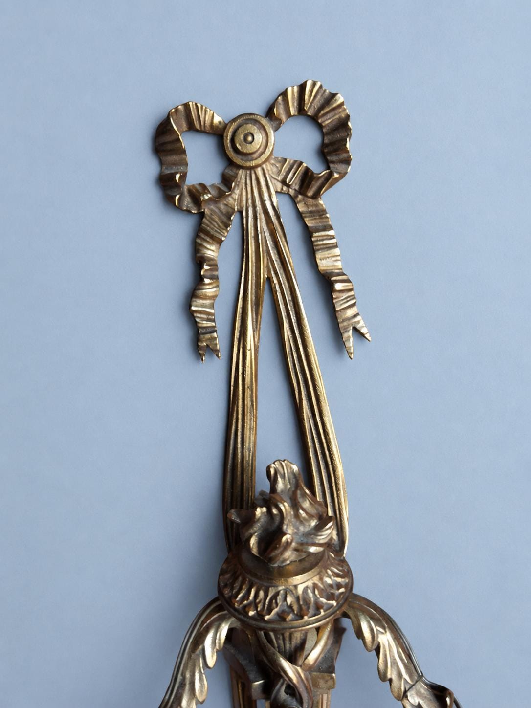 Vintage Louis XVI Style Three-Light Bronze-Tone Torch Wall Sconce with Ribbon Bow Crest