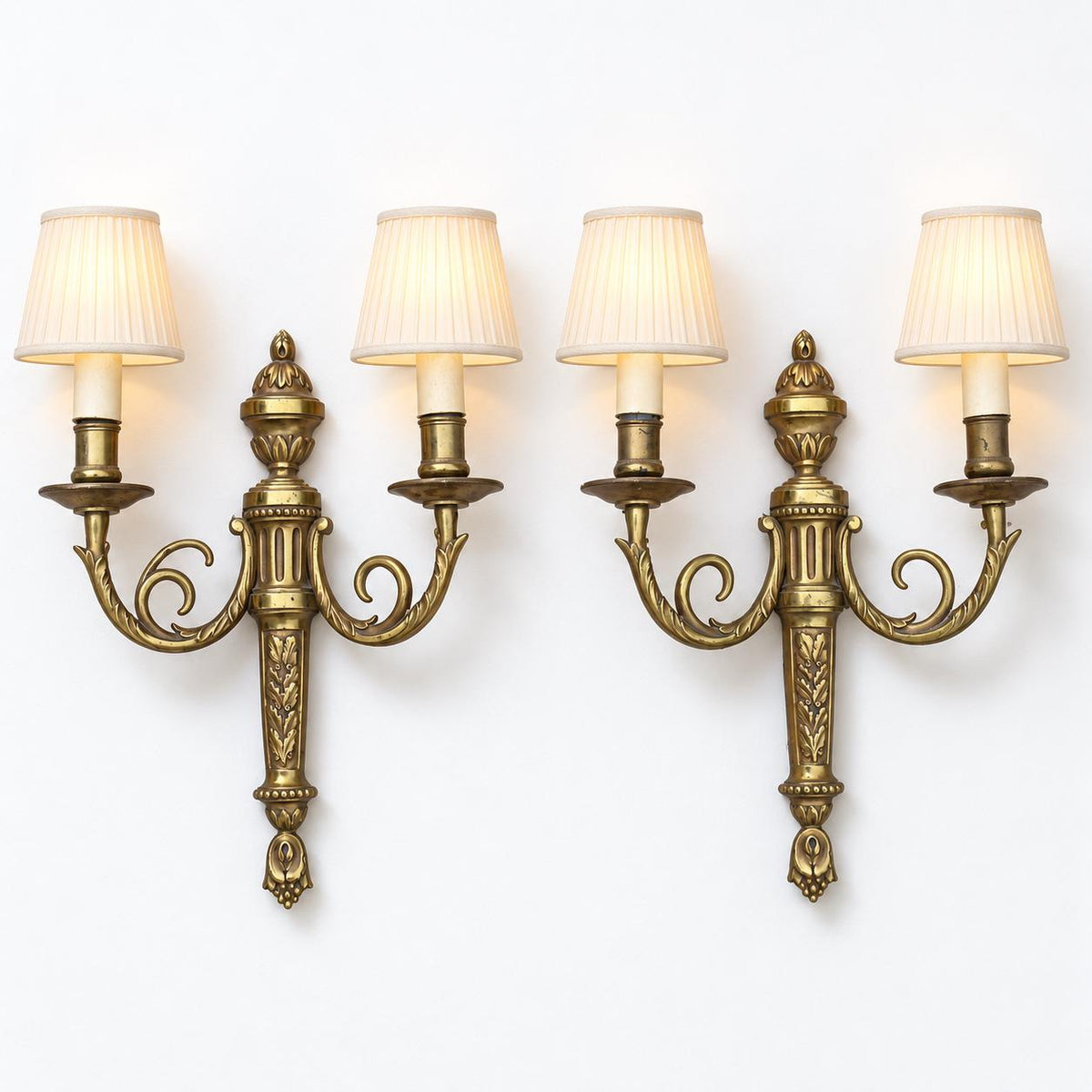 Vintage Pair of Louis XVI Style Brass-Tone Two-Arm Wall Sconces with Urn and Oak-Leaf Shaft