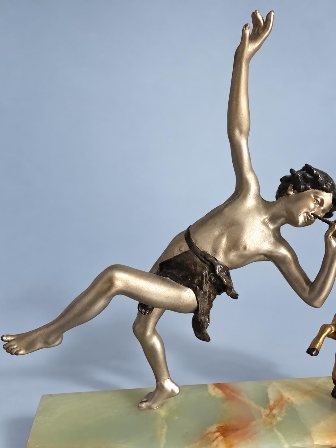 Vintage Art Deco Spelter Sculpture of Pan Playing Pipes with Leaping Goat, Silver and Gold Finish on Onyx and Black Marble Base