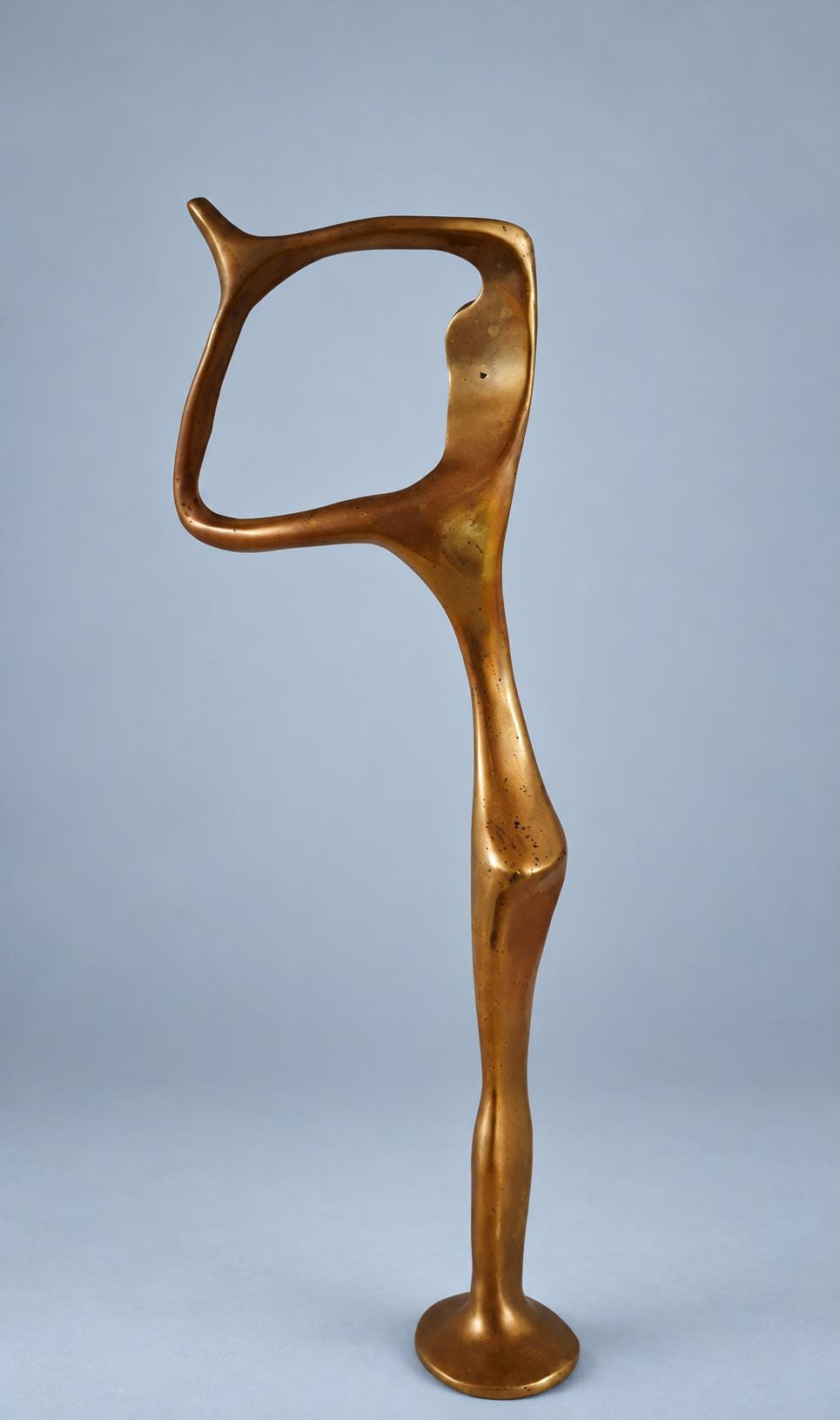 Vintage Modernist Abstract Figure Sculpture, Solid Gold-Tone Metal, Open Arm Loop, Elongated Form on Round Base, 32 cm