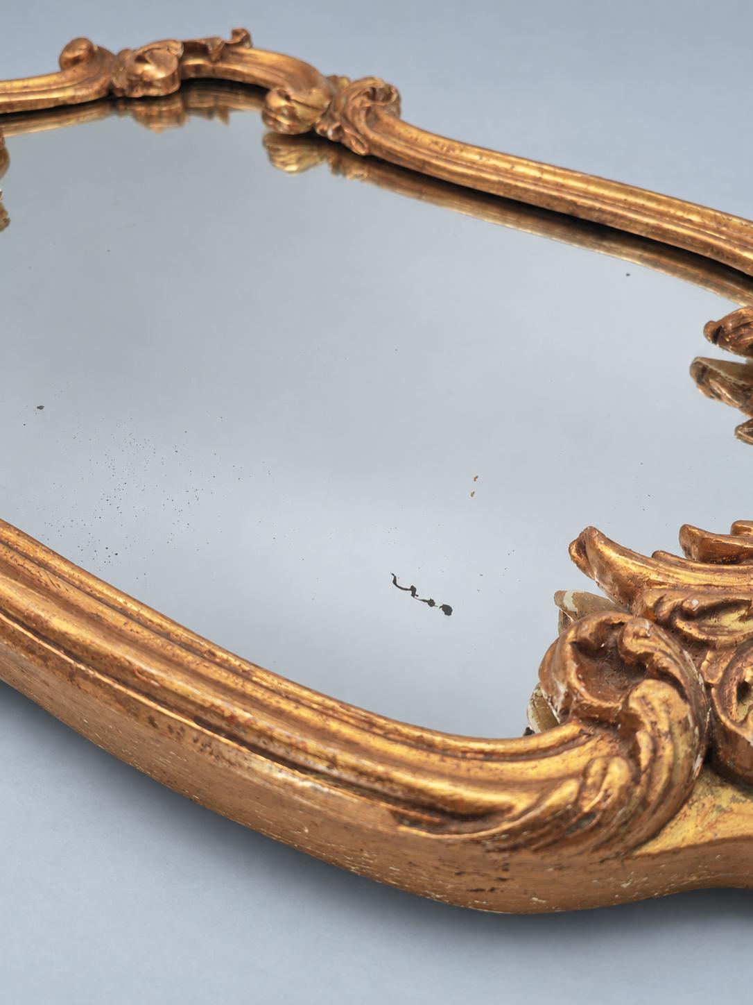 Vintage Rocaille Style Giltwood and Gilt Stucco Mirror, Shell Crest and Scrolls, Shaped Frame on Small Feet, 42 cm