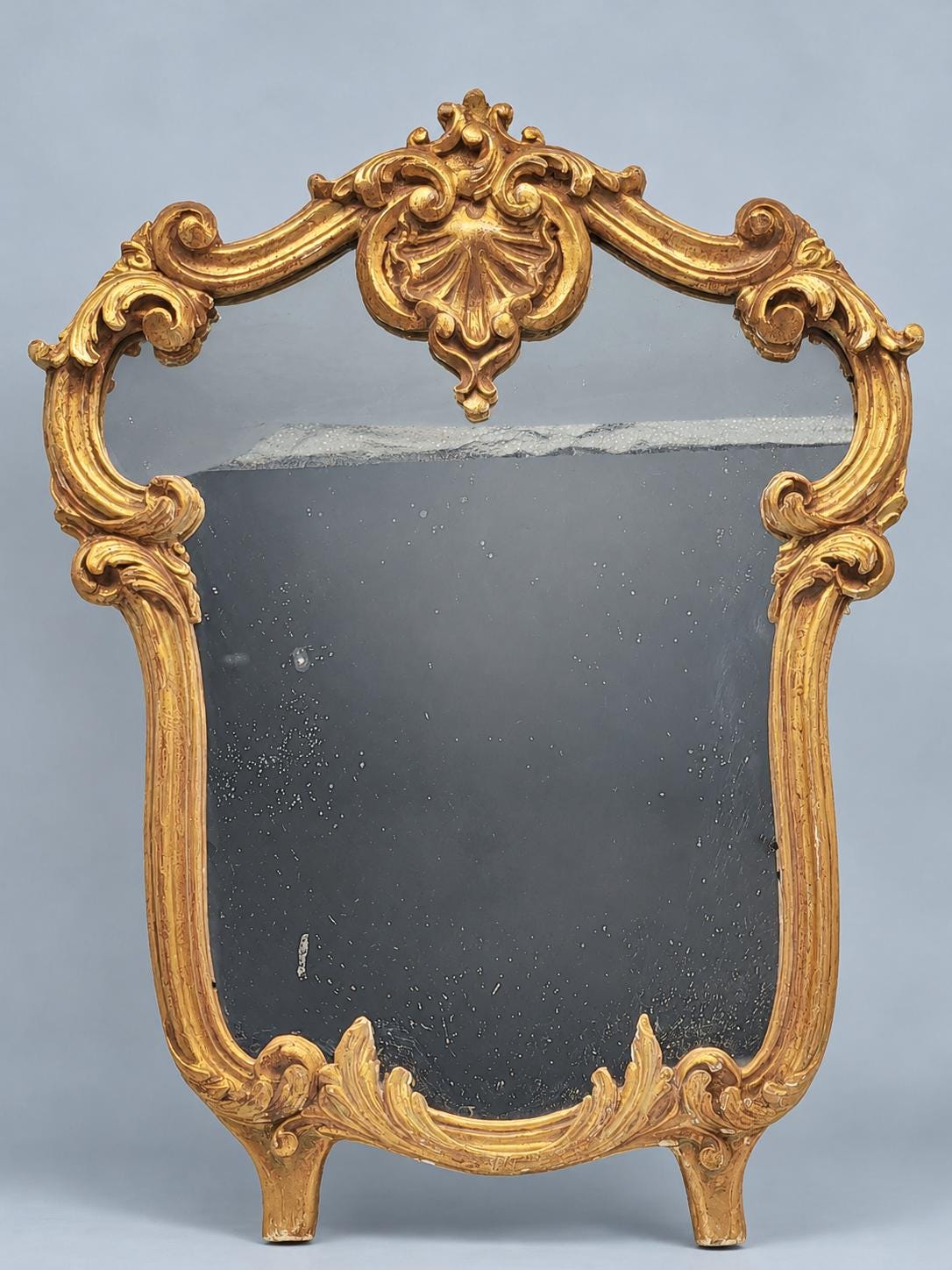 Vintage Rocaille Style Giltwood and Gilt Stucco Mirror, Shell Crest and Scrolls, Shaped Frame on Small Feet, 42 cm