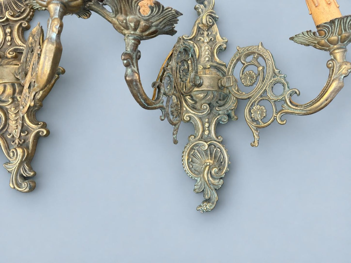 Vintage Pair of Louis XV Rocaille Style Wall Sconces, Cast Metal with Green Patina, Shell Crest and Pierced Scroll Arms, Two Lights Each