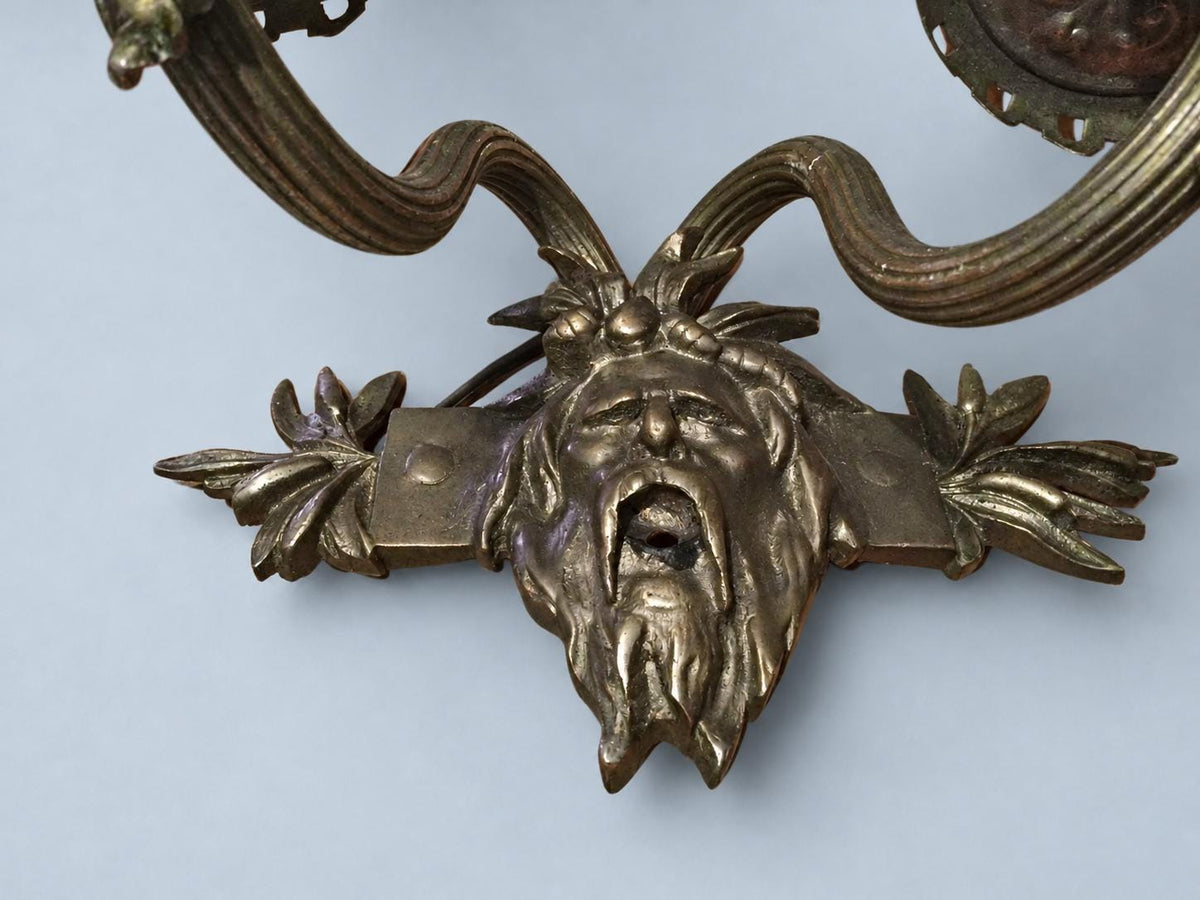 Vintage Pair of Wall Sconces with Bearded Bacchus-Style Masks, Patinated Metal with Leafy Arms, Two Lights Each