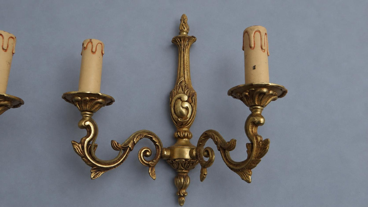 Vintage Pair of Louis XV Style Gilt Metal Wall Sconces, Flame Finials and C-Scroll Backplates, Leafy Scrolled Arms, Two Lights Each
