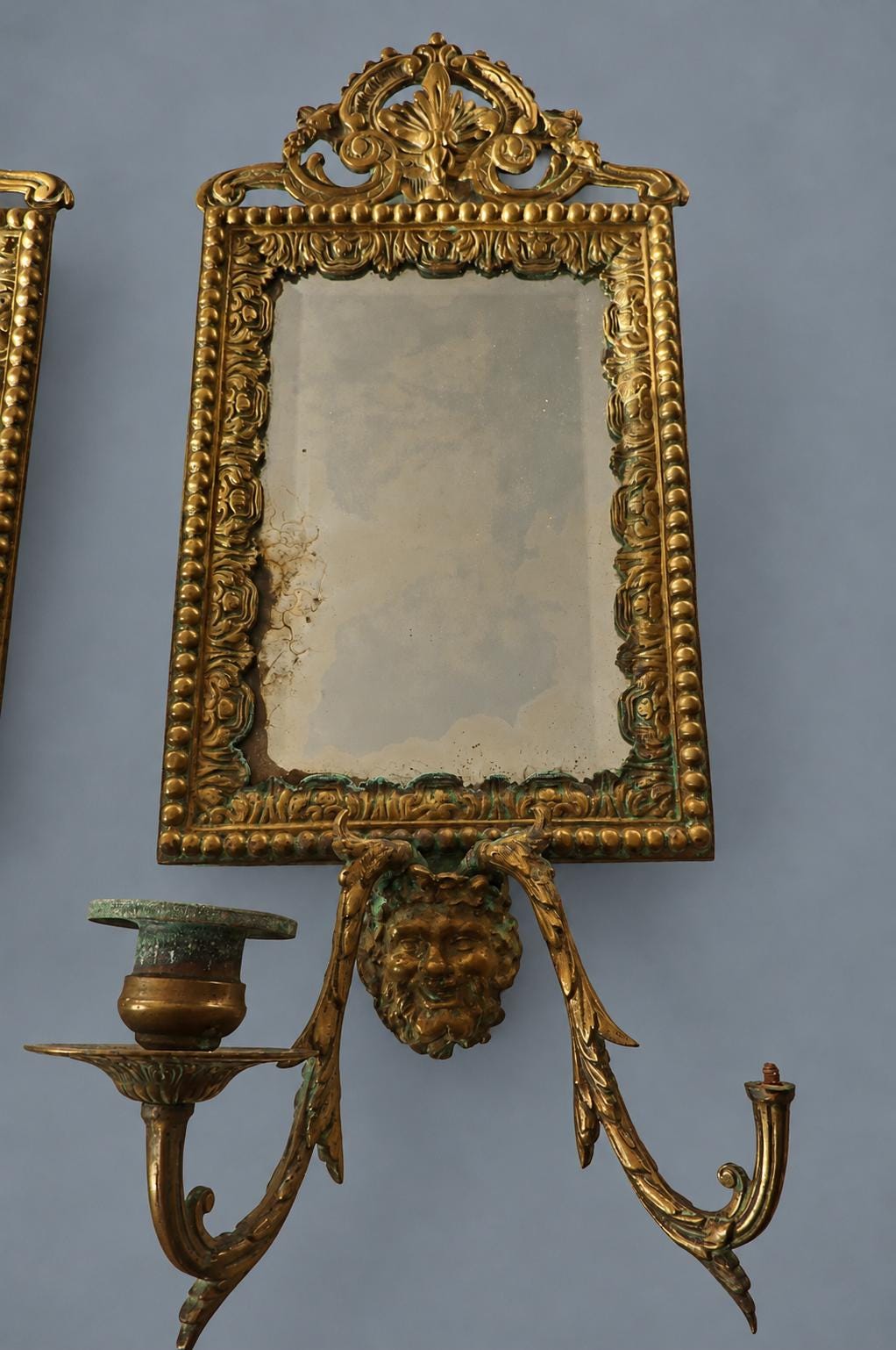 Vintage Pair of Mirror Wall Sconces with Masks, Patinated Metal Beaded Frames and Palmette Crests, Bevelled Mirrors, Two Lights Each, 41 cm